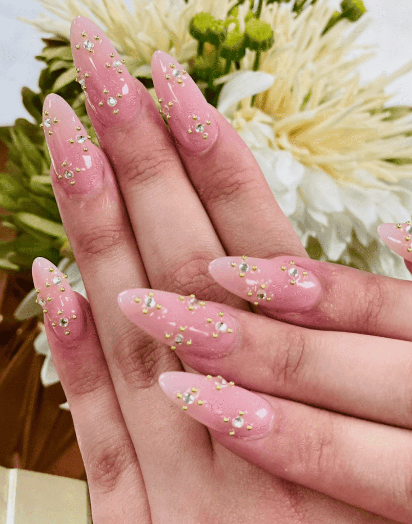 Elegant pink gel nails with flowers Hy Nails Inc Cambridge